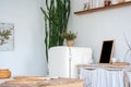 White textured kitchen in the style of shabby. A large textured table in the ecological style and Loft style. Rustic wicker napkin Royalty Free Stock Photo