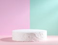 White Textured Podium on Pastel Pink and Green Background Royalty Free Stock Photo