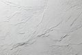 White textured wall background with rough plaster finish and abstract wavy patterns, full frame Royalty Free Stock Photo
