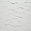 White textured wall featuring a smooth plaster finish with irregular, overlapping Royalty Free Stock Photo