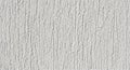 White Textured Wall Surface with Vertical Grooves and Rough Finish background Royalty Free Stock Photo