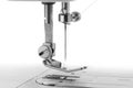 White thread through the needle eye.The side of the sewing machine Royalty Free Stock Photo