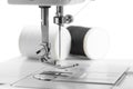 White thread through the needle eye.The side of the sewing machine Royalty Free Stock Photo