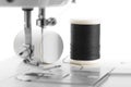 White thread through the needle eye.The side of the sewing machine Royalty Free Stock Photo