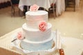 White three-tiered wedding cake Royalty Free Stock Photo
