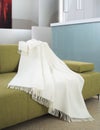 White throw draped over a settee Royalty Free Stock Photo