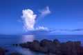 White thunderhead cloud over calm sea