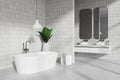 White tile bathroom corner with double sink and tub Royalty Free Stock Photo