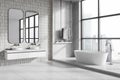 White tile bathroom corner with double sink, tub and window Royalty Free Stock Photo