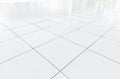 White tile floor clean condition with grid line for background