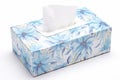 White tissue box with blue flowers on white background. Isolate close up