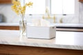 white tissue box on marble kitchen countertop
