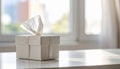 White tissue box with tissue pulled out on a reflective surface tissues paper Royalty Free Stock Photo
