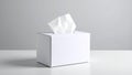 White tissue box on a white surface, with a gray background. Royalty Free Stock Photo