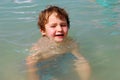 White Toddler Boy playing in Ocean