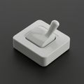 White toggle switch with a rectangular base on a dark gray surface. The switch is in Royalty Free Stock Photo