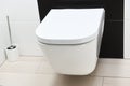 White toilet hanging on a black wall Royalty Free Stock Photo