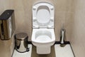 White toilet with the lid raised in the booth of a public toilet Royalty Free Stock Photo