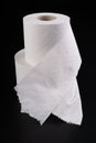 White toilet paper on a dark table. Articles for daily hygiene