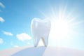 White tooth on blue background, light emphasizes the purity of the tooth Royalty Free Stock Photo