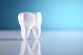 White tooth on blue background, light emphasizes the purity of the tooth Royalty Free Stock Photo