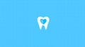 A white tooth with a blue heart on it Royalty Free Stock Photo