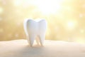 White tooth, sunlight emphasizes the cleanliness of the tooth, body background Royalty Free Stock Photo