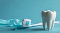 White tooth, tube of toothpaste and toothbrush with on pastel blue background. People's dental hygiene. Royalty Free Stock Photo