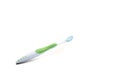 White toothbrush green stripe blue bristles used for a long time