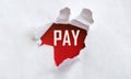 White torn paper with text Pay on red background Royalty Free Stock Photo