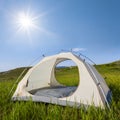 White touristic tent among a green hills