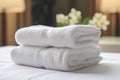 white towel on bed decoration in hotel bedroom interior - soft focus point, clean white towels on the hotel bed, feels cozy, Royalty Free Stock Photo