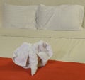 White towel in form of elephant on bed Royalty Free Stock Photo