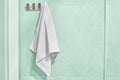 White towel hanging on a wall in bathroom Royalty Free Stock Photo