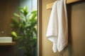 A white towel hangs on the wall in the bathroom Royalty Free Stock Photo