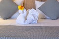 White towel swan on bed