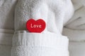 White towel symbol of love heart red closeup room decor honeymoon newlyweds Royalty Free Stock Photo