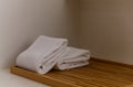 White towel on wooden board in bathroom. hygiene, shower, bath, freshness concept Royalty Free Stock Photo