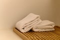 White towel on wooden board in bathroom. hygiene, shower, bath, freshness concept Royalty Free Stock Photo