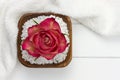 White towel and wooden bowl filled with bath salt Royalty Free Stock Photo