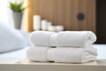 White towels on bed in hotel room, closeup. Space for text, clean white towels on the hotel bed, feels cozy, comfortable and relax Royalty Free Stock Photo