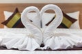 White towels folded into the shape of a pair of swans to symbolize love and fidelity are placed on the suite beds as towels Royalty Free Stock Photo