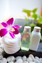 White towels, orchid and bath lotion