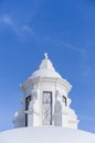 White tower with catholic cross on top in the roof of the Cathedral in Leon city, Nicaragua Royalty Free Stock Photo