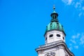 White tower,green roof,gold cross on top Royalty Free Stock Photo