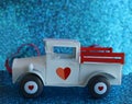 White toy pick up truck with hearts on tires Royalty Free Stock Photo