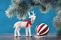 White toy reindeer on Christmas blue background Royalty Free Stock Photo