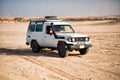 White toyota car driving in desert of Hurghada, Egypt