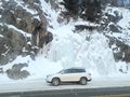 White Toyota Highlander by a Frozen Waterfall in Anchorage Municipality, Alaska on a Cold Winter Day