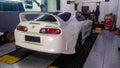 white Toyota Supra A80 mark 4 in a workshop